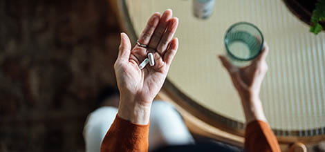 POV shot of taking pills